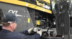 Man working on equipment Man working on equipment