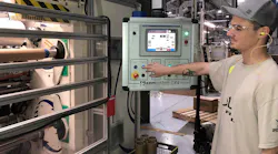 Intertape employee at screen in factory