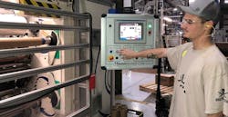 Intertape employee at screen in factory Intertape employee at screen in factory