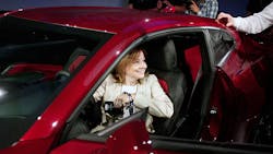 GM CEO Mary Barra poses in a Camaro. GM CEO Mary Barra poses in a Camaro.