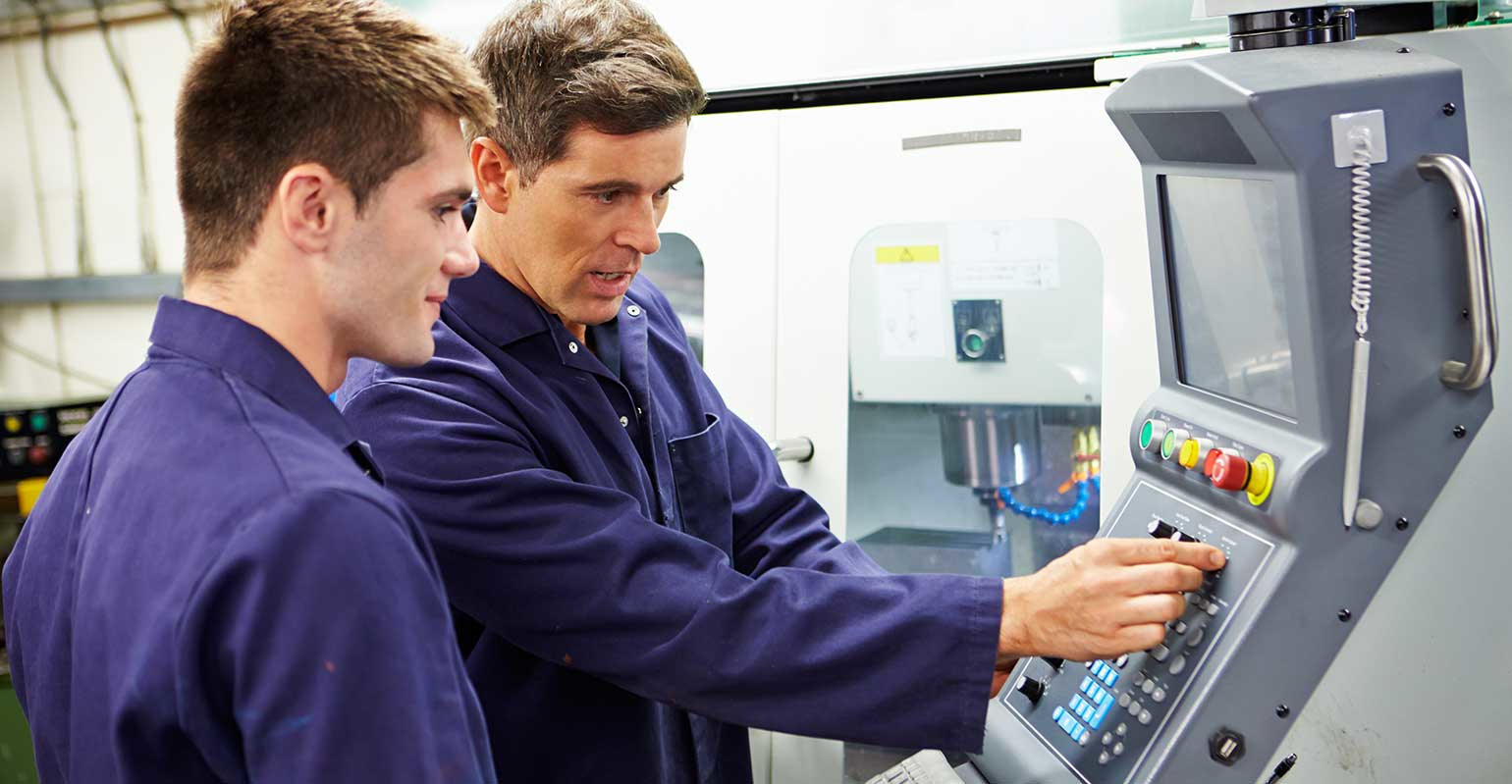 student at automated milling machine