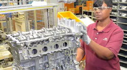 Alabama Hyundai employee works on engine
