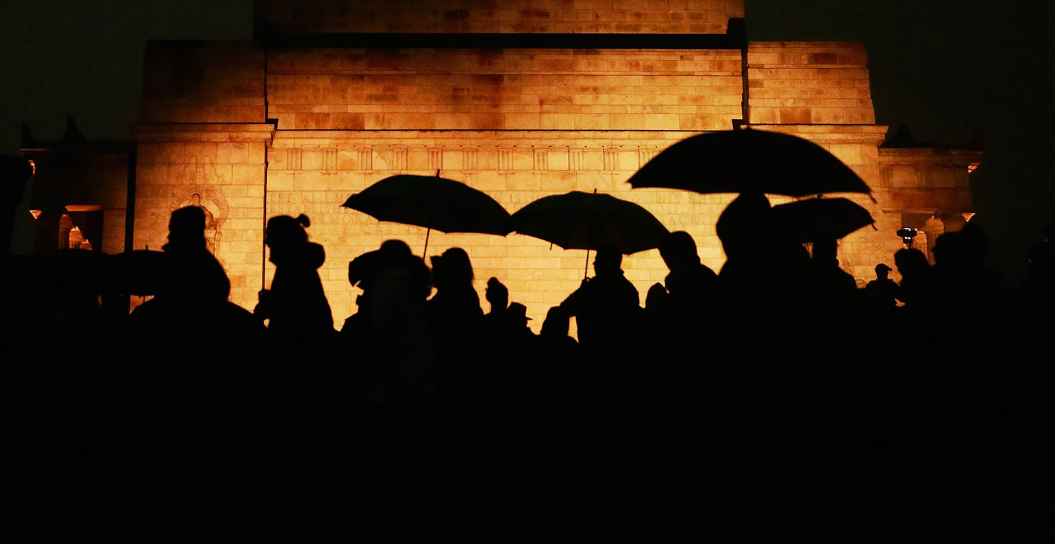 shadow of people with umbrellas