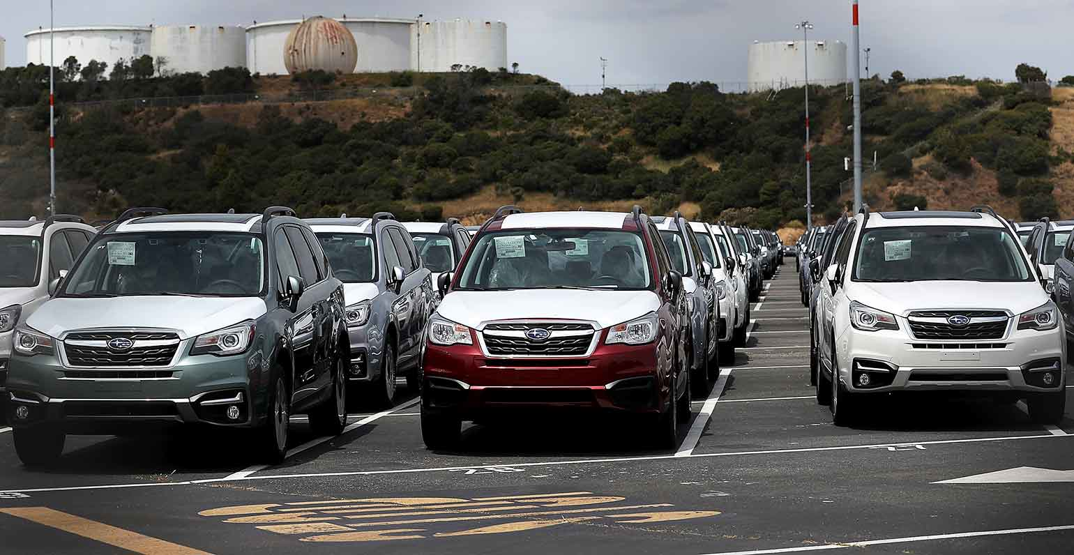 New cars sit in a lot at the Auto Warehousing Co. near the Port of Richmond.