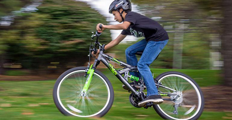 boy on Kent International bicycle