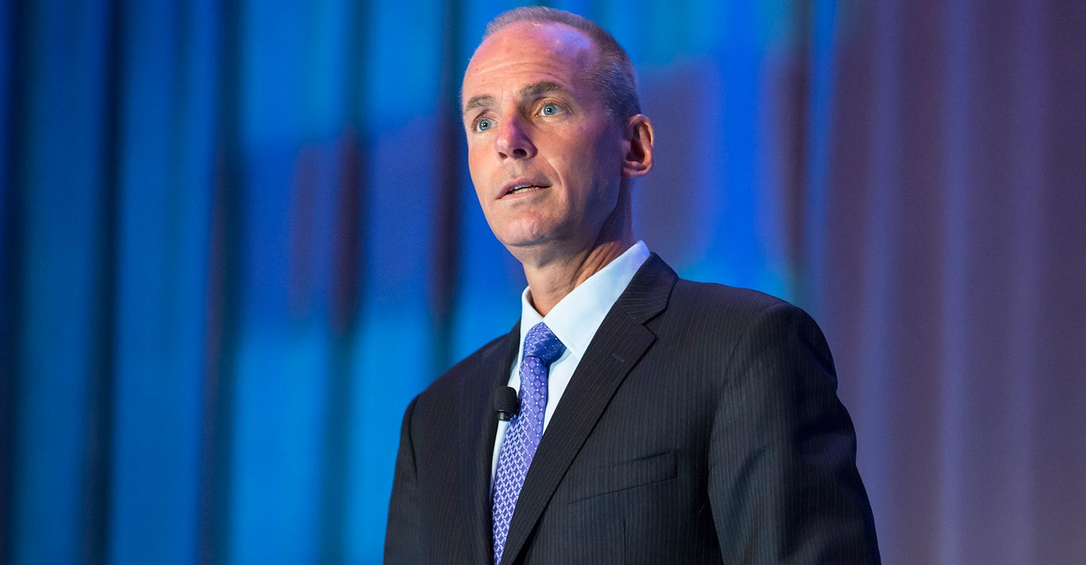 Dennis Muilenburg against blue background
