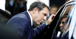 General Motors' Mark Reuss looks in car window General Motors' Mark Reuss looks in car window