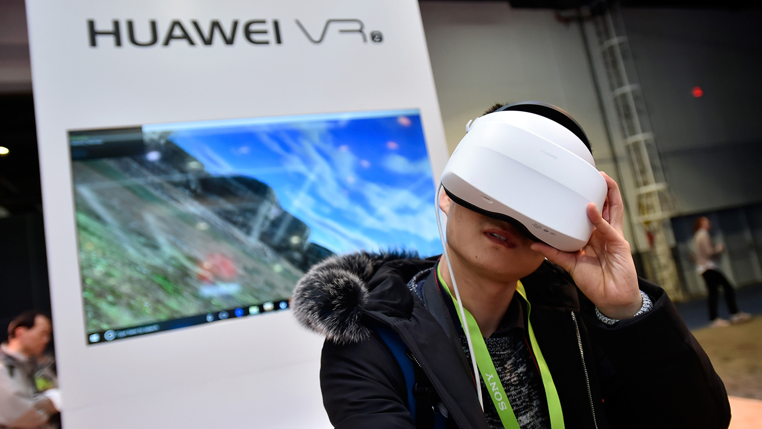 man looking through Huawei VR