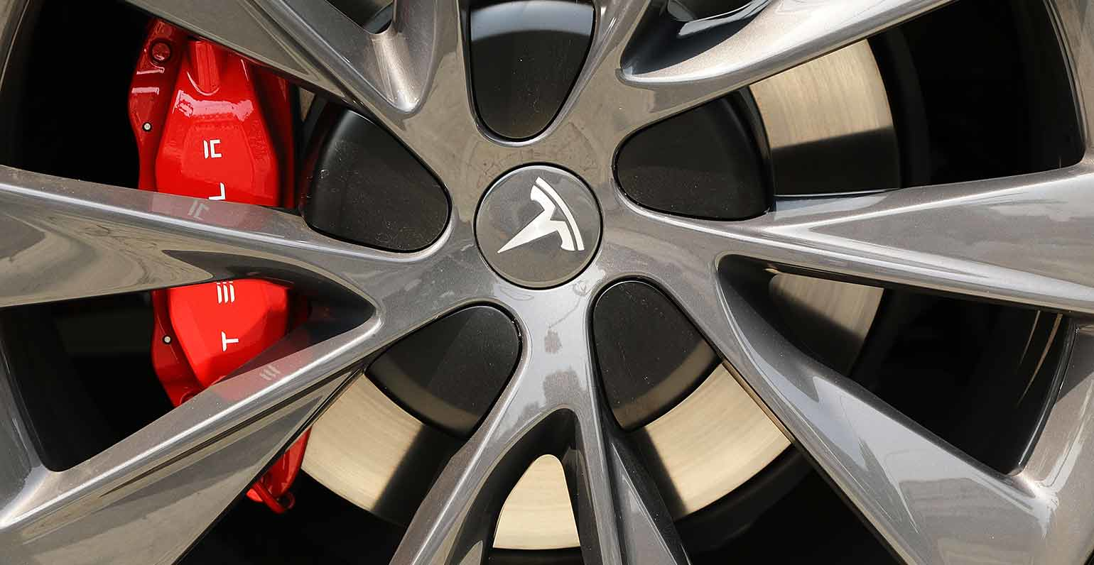 Tesla logo on wheel of Tesla car