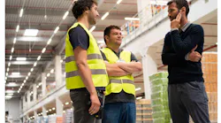 manager speaking with employees
