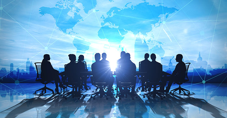 team around table, blue background