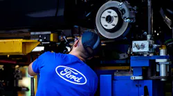 Employee works on Ford Mondeo at factory in Valencia, Spain.