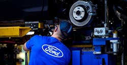 Employee works on Ford Mondeo at factory in Valencia, Spain. Employee works on Ford Mondeo at factory in Valencia, Spain.