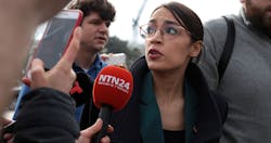 alexandria-ocasio-cortez-mic-alex-wong-getty alexandria-ocasio-cortez-mic-alex-wong-getty