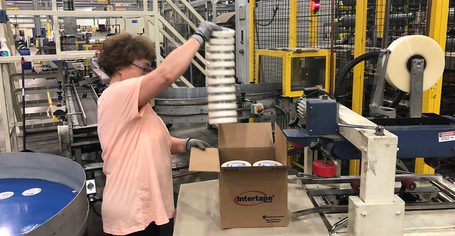 worker packing at Intertape Polymer Group