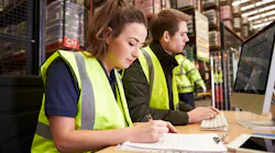 Staff managing warehouse logistics