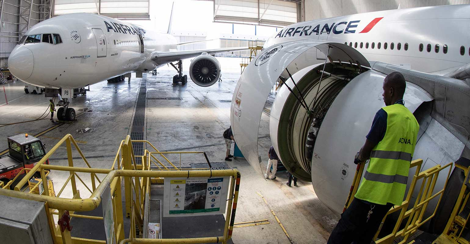 air-france-boeing-airplanes-workers-hangar-Joel-Saget-AFP-Getty-Images.jpg