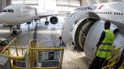 Industryweek 35825 Air France Boeing Airplanes Workers Hangar Joel Saget Afp Getty Images