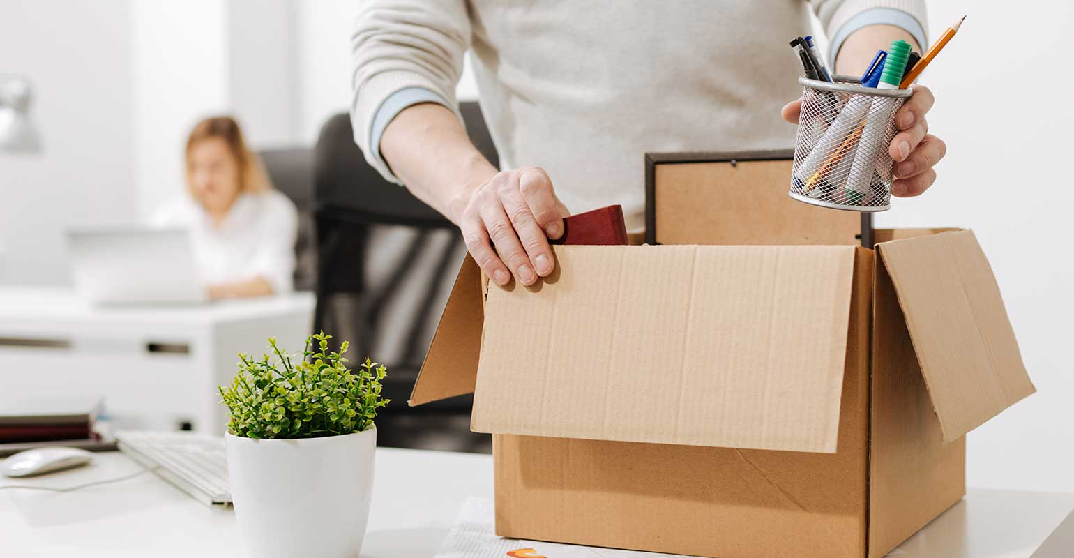 man-packing-up-desk-unemployment-unemployed-fired-yacobchuk-istock-getty-images-plus.jpg