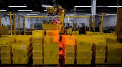 Industryweek 35878 Amazon Robot Warehouse Arm Yellow Tubs Johannes Eisele Afp Getty Images