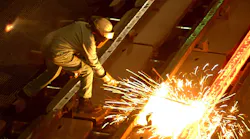 steel-worker-cuts-billet-sparks-david-mcnew-staff-getty-images.jpg