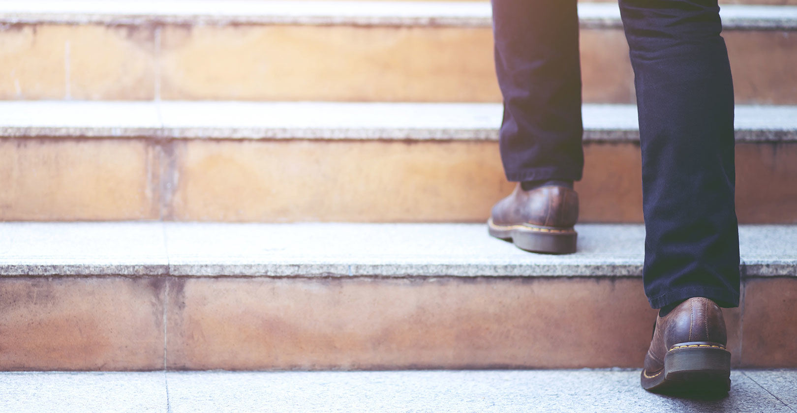 man walking up stairs