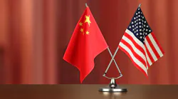 chinese-american-crossed-flag-on-desk-negotiation-studiocasper-istock-getty2.jpg