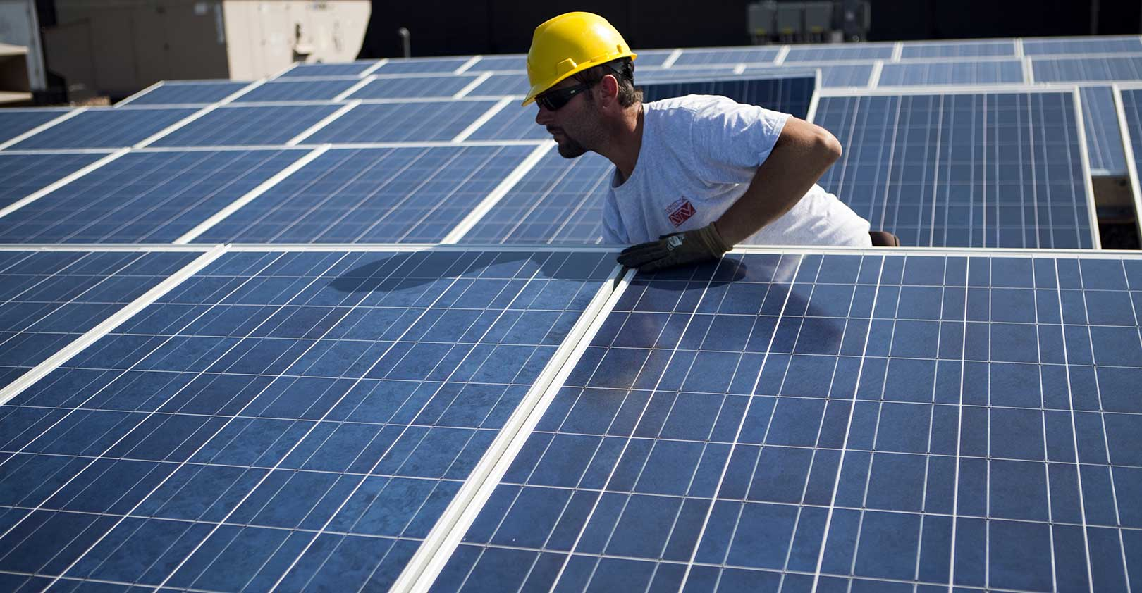solar-panel-installation-worker-yellow-hardhat-Robert-Nickelsberg-Getty.jpg