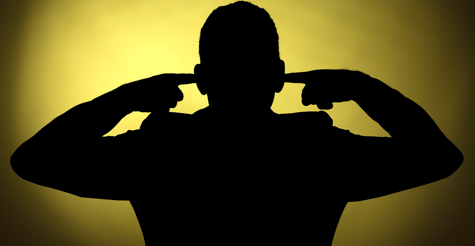 silhouette of man holding ears.jpg