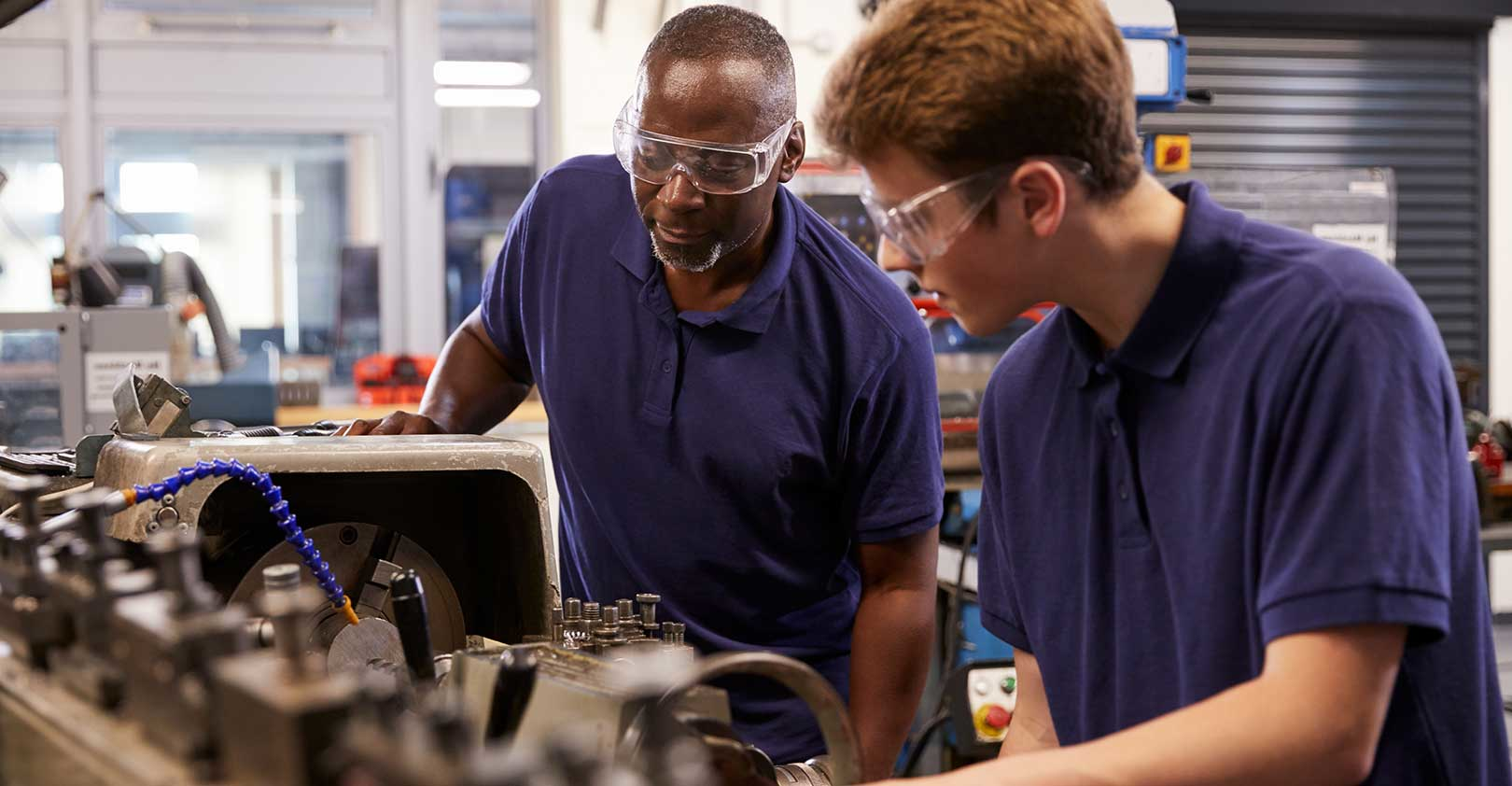 engineer-showing-training-apprentice-how-to-use-lathe-flipped-monkeybusinessimages-istock-getty-images.jpg