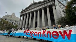 Protesters outside the New York Supreme Court building. Two states, New York and now Massachusetts, have filed lawsuits against the energy company alleging that they concealed information from investors about the cost of carbon emissions.