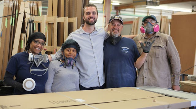 Zenbooth CEO Sam Johnson, third from left, poses with some of his manufacturing crew.