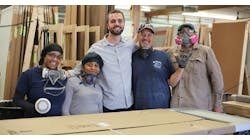Zenbooth CEO Sam Johnson, third from left, poses with some of his manufacturing crew.