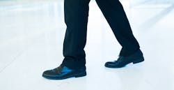 lower half of male body in business suit walking lower half of male body in business suit walking