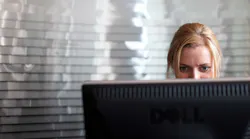 woman-using-dell-monitor-receptionist-Richard-Baker-Corbis-Getty-Images.jpg