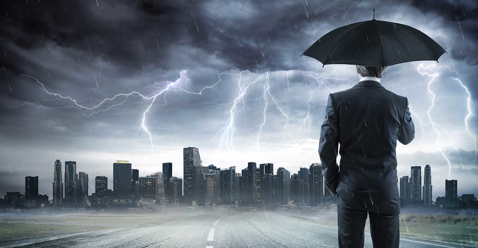 storm-business-man-with-umbrella-istock-getty.jpg
