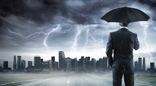 Industryweek 36542 Storm Business Man With Umbrella Istock Getty