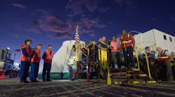 NASA astronauts Nicole Mann and Mike Fincke and Boeing astronaut Chris Ferguson observe a moment of silence with teams from NASA, Boeing and the White Sands Missile Range, honoring the victims of the Sept. 11 terrorist attacks, September 11, 2019 at the White Sands Missile Range outside Las Cruces, New Mexico. The joint teams gathered in the desert to rehearse landing and crew extrication from Boeings CST-100 Starliner, which will be used to carry humans to the International Space Station. Mann, Fincke and Ferguson will fly to the space station aboard the Starliner for the Boeing Crew Flight Test mission.