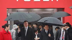 Elon Musk walks with Shanghai Mayor Ying Yong during the ground-breaking ceremony for a Tesla factory in Shanghai on January 7, 2019.