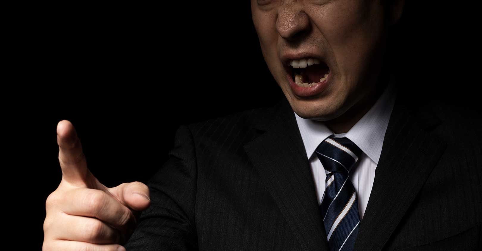 bully-suited-man-pointing-angry-authority-abuse-istock-getty.jpg