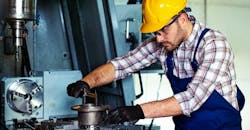 Industryweek 36679 Worker Using Cnc Milling Machine Workshop Istock Getty