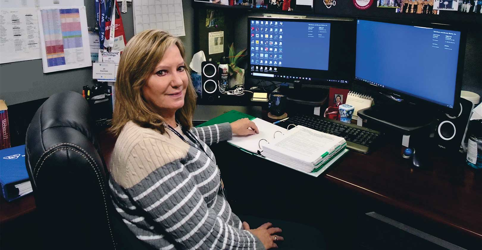Jo Stanton of T&S Brass and Bronze Works seat at a desk