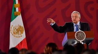 Mexican President Andres Manuel Lopez Obrador speaks at a press conference. He announced that all three countries in the USMCA would sign the revised deal Tuesday.