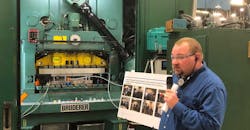 TE Connectivity maintenance manager Tony Burkett shows off some of the tools used to find energy savings opportunities at the company&apos;s Lickdale, Pennsylvania, plant during a U.S. Department of Energy tour of the facility.