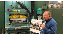 TE Connectivity maintenance manager Tony Burkett shows off some of the tools used to find energy savings opportunities at the company&apos;s Lickdale, Pennsylvania, plant during a U.S. Department of Energy tour of the facility.