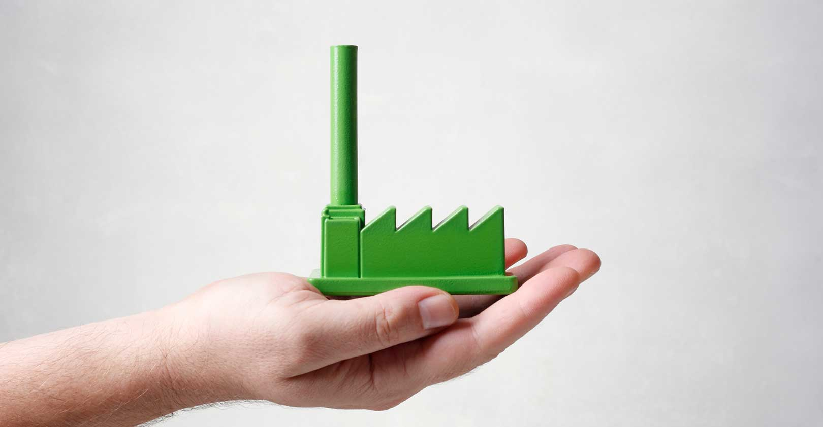 tiny-green-factory-in-palm-of-hand-istock-getty.jpg
