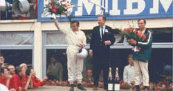 Bruce McLaren, Henry Ford II and Chris Amon on the victory rostrum at 24 Hours of Le Mans 1966. Bruce McLaren, Henry Ford II and Chris Amon on the victory rostrum at 24 Hours of Le Mans 1966.