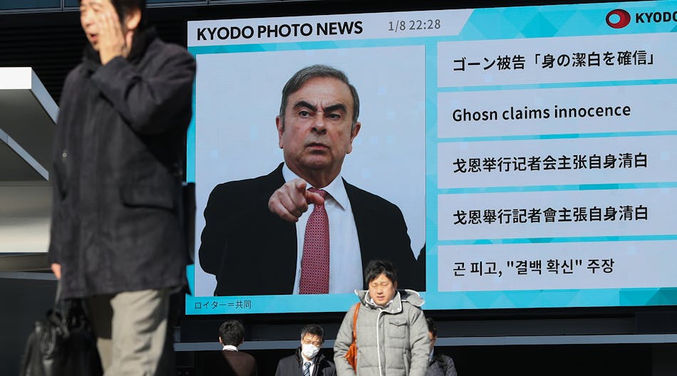 Ghosn press conference on screen after flight to Lebanon