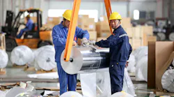 Workers at a factory in Huaibei, China, package sheet aluminum.