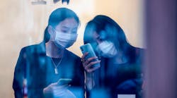 China Women Virus Masks Phone Noel Celis Afp Via Getty Images